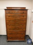 A continental mahogany seven drawer chest,