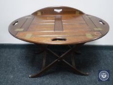 A rectangular mahogany folding butler's table