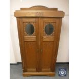 An oak double door hall cabinet,