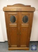 An oak double door hall cabinet,