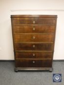 A continental mahogany six drawer chest,