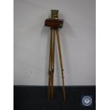 An early twentieth century mahogany and brass plate camera on tripod stand CONDITION