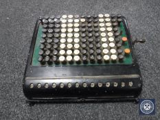 A vintage enamelled calculator