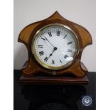 A shaped inlaid mahogany mantel clock with key