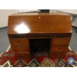 An early 20th century mahogany bureau,