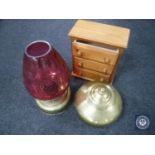 A miniature pine three-drawer chest together with a brass lidded urn and a brass oil lamp with