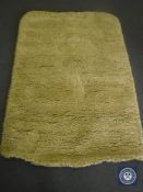 A hand tuffted white / yellow rug, 120 cm x 180 cm, rrp £297.00.