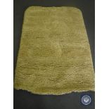 A hand tuffted white / yellow rug, 120 cm x 180 cm, rrp £297.00.