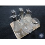 A tray of four cut glass plated claret jugs together with a lead crystal rose bowl