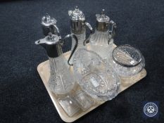 A tray of four cut glass plated claret jugs together with a lead crystal rose bowl