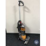 A Dyson DC 24 upright vacuum cleaner