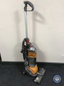 A Dyson DC 24 upright vacuum cleaner
