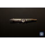 An early 20th century diamond bar brooch, the total diamond weight estimated at 0.