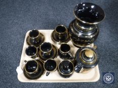 A tray of sixteen piece black and gilt Greek tea service together with matching vase