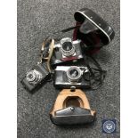 A Petri 7S camera with lens in leather case together with a Praktica Pl Nova IB camera with lens in
