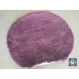 A hand knotted shaggy purple rug, 150 cm x 150 cm, rrp £309.00.