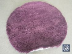 A hand knotted shaggy purple rug, 150 cm x 150 cm, rrp £309.00.