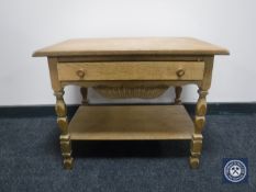 A continental oak sewing table fitted a drawer