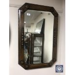 An early 20th century octagonal oak framed mirror