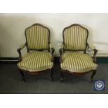 A pair of antique armchairs in Regency stripe fabric