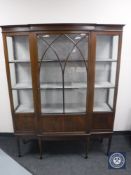 An Edwardian inlaid mahogany break-front display cabinet