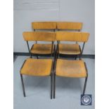 Four metal framed stacking school chairs