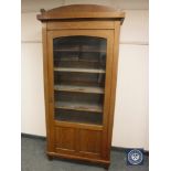 An Edwardian inlaid mahogany glazed bookcase,
