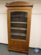 An Edwardian inlaid mahogany glazed bookcase,