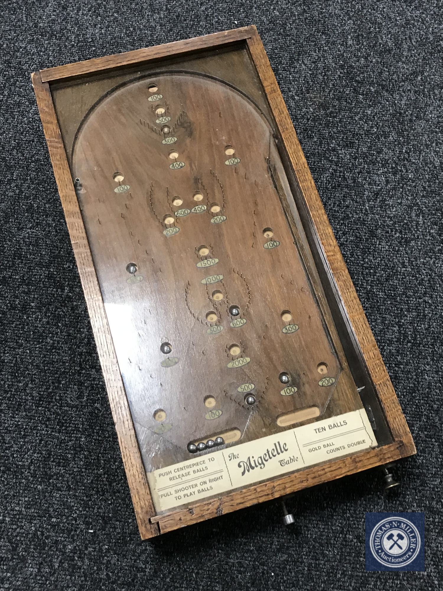 An early 20th century counter top 'The Migetelle' table bagatelle game