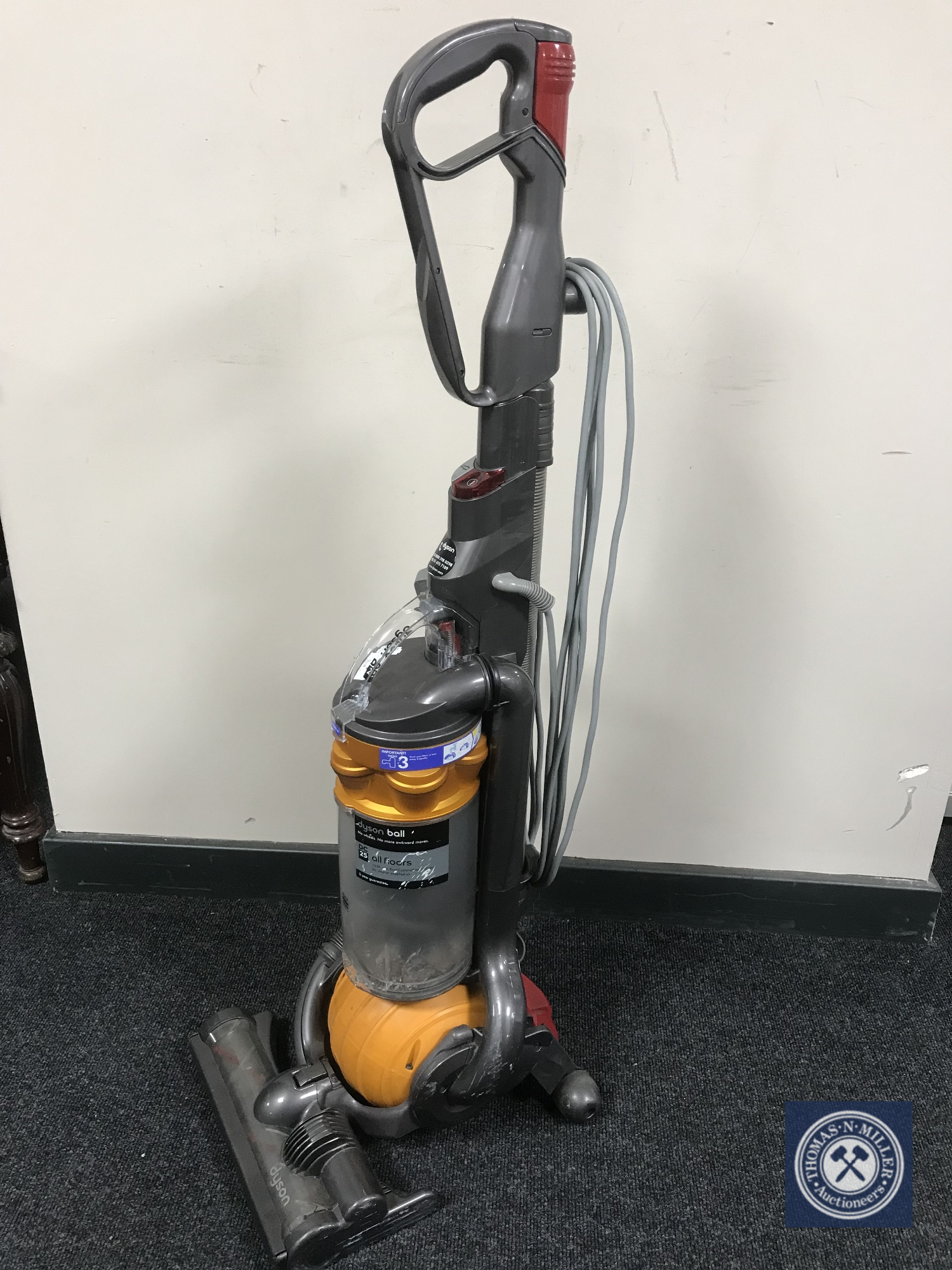 A Dyson DC 25 upright vacuum