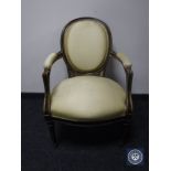 A continental salon armchair in gold fabric