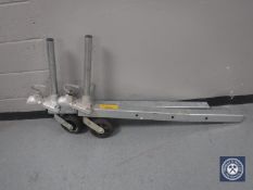 Two metal trailer hitch arms