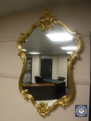 A gilt framed Rococo style mirror, height 99 cm.