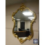 A gilt framed Rococo style mirror, height 99 cm.