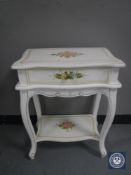 A contemporary painted side table fitted a drawer