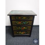 A 20th century oak hand painted four drawer chest