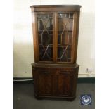 A mahogany corner display cabinet