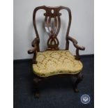 An early 20th century Queen Anne style armchair