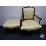 A continental style armchair and footstool in gold fabric