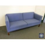 A late 20th century settee in blue fabric