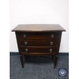 A mid 20th century three drawer chest