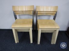 A set of six pine stacking chairs