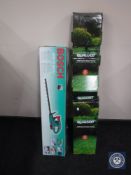 A boxed Bosch electric chain saw and a boxed Qualcast hedge trimmer