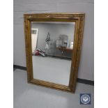 An early 20th century gilt and gesso overmantel mirror