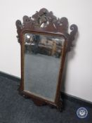 A mahogany Chippendale style bevelled edged mirror