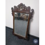 A mahogany Chippendale style bevelled edged mirror