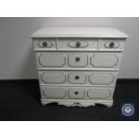 An early 20th century painted pine four drawer chest
