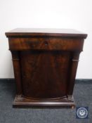 A 19th century mahogany pedestal cabinet fitted a drawer