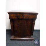 A 19th century mahogany pedestal cabinet fitted a drawer