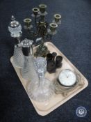 A tray containing brass five sconce candelabrum, two decanters with stoppers,